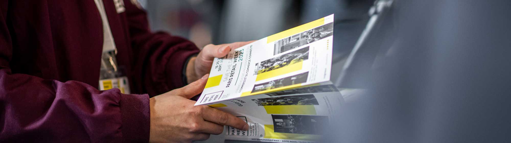 Man holding a program in his hands