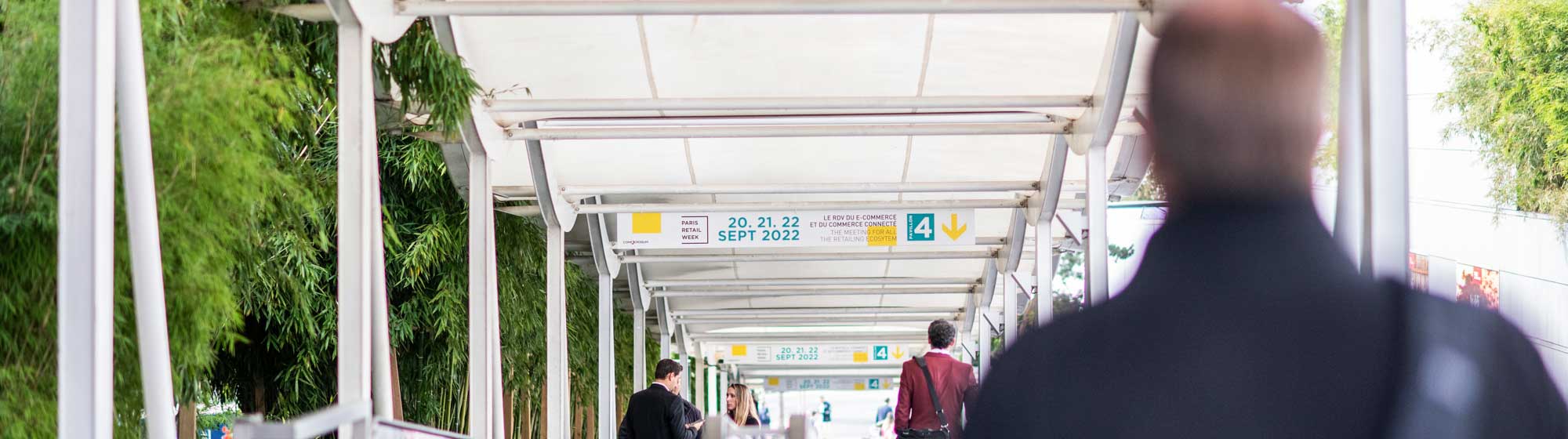 Visitors under the arcades at the entrance