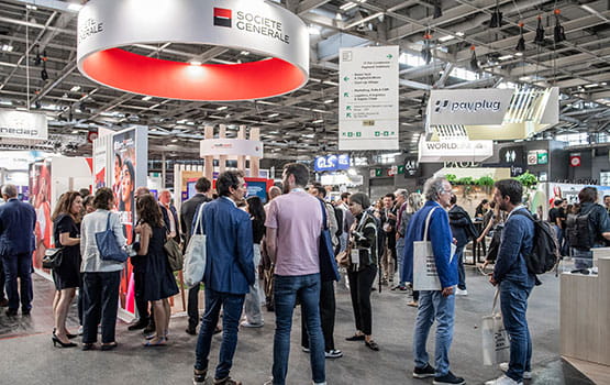 Visitors in front of the Société Générale stand