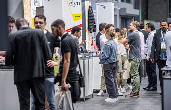 Visitors chatting at the entrance to the exhibition