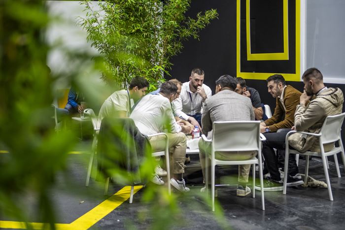 Eight men around a table